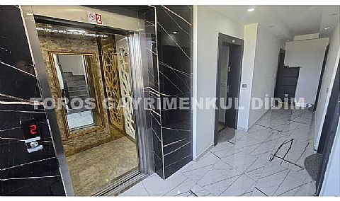 Didim altınkum çamlıkta plaja 300 mt mesafede asansörlü binada satılık dublex