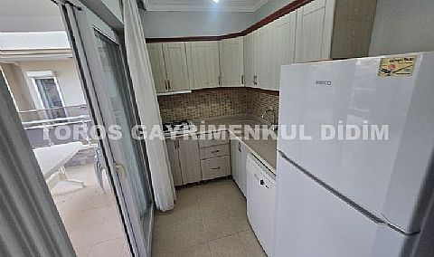 Didim Altınkum havuzlu sitede satılık 3+1  eşyalı geniş bakonlu orta kat daire