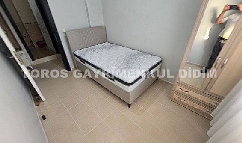 Didim Altınkum havuzlu sitede satılık 3+1  eşyalı geniş bakonlu orta kat daire