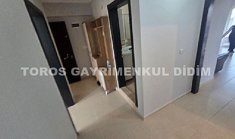 Didim Altınkum havuzlu sitede satılık 3+1  eşyalı geniş bakonlu orta kat daire