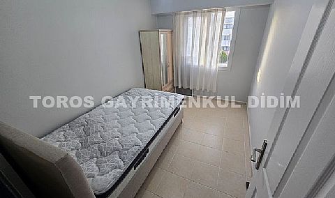 Didim Altınkum havuzlu sitede satılık 3+1  eşyalı geniş bakonlu orta kat daire