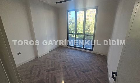 didim çamlıkta denize 400 mt mesafede satılık 1+1 daire