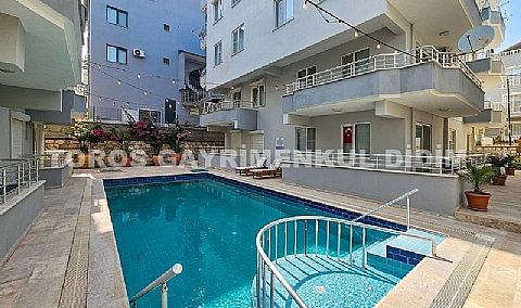 Didim efelerde havuzlu sitede satılık 2+1 eşyalı daire