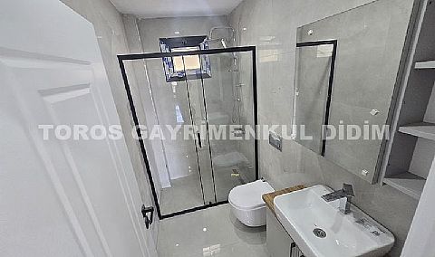 Didim hisarda satılık bahçeli giriş kat ayrı mutfaklı daire