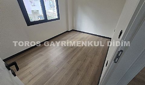 Didim hisarda satılık bahçeli giriş kat ayrı mutfaklı daire