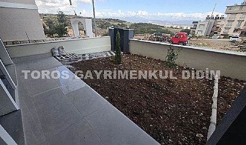 Didim hisarda satılık bahçeli giriş kat ayrı mutfaklı daire