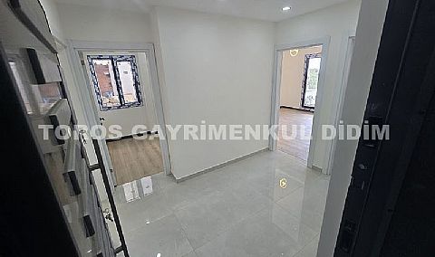 Didim hisarda satılık bahçeli giriş kat ayrı mutfaklı daire