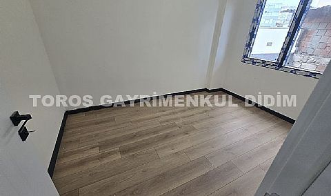 Didim hisarda satılık bahçeli giriş kat ayrı mutfaklı daire