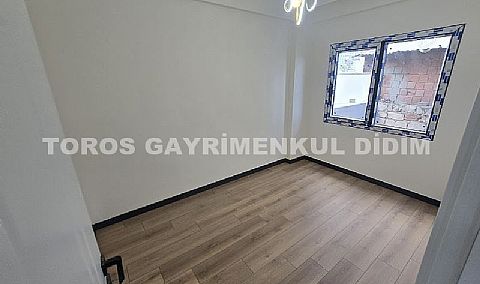 Didim hisarda satılık bahçeli giriş kat ayrı mutfaklı daire