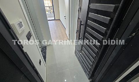 Didim hisarda satılık bahçeli giriş kat ayrı mutfaklı daire