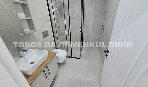 Didim hisarda satılık bahçeli giriş kat ayrı mutfaklı daire