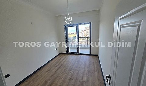 Didim hisarda satılık bahçeli giriş kat ayrı mutfaklı daire